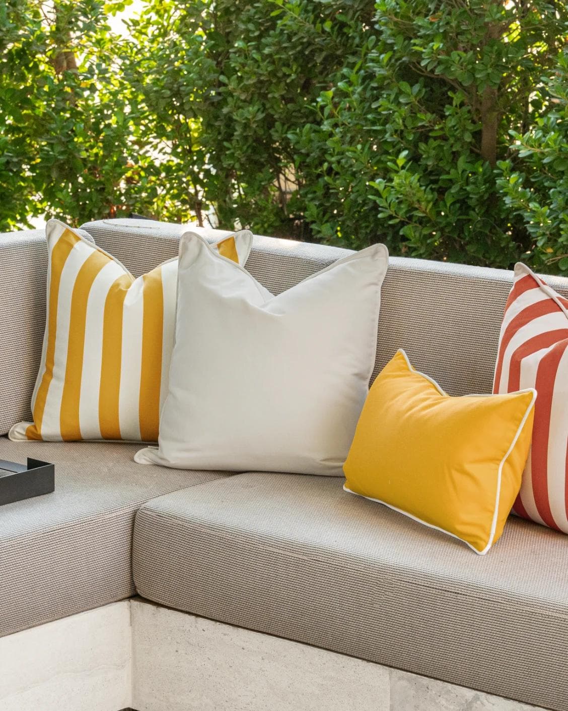 Aarush Bundle cushion in orange, yellow and ivory, shown in a lifestyle right view as image 2