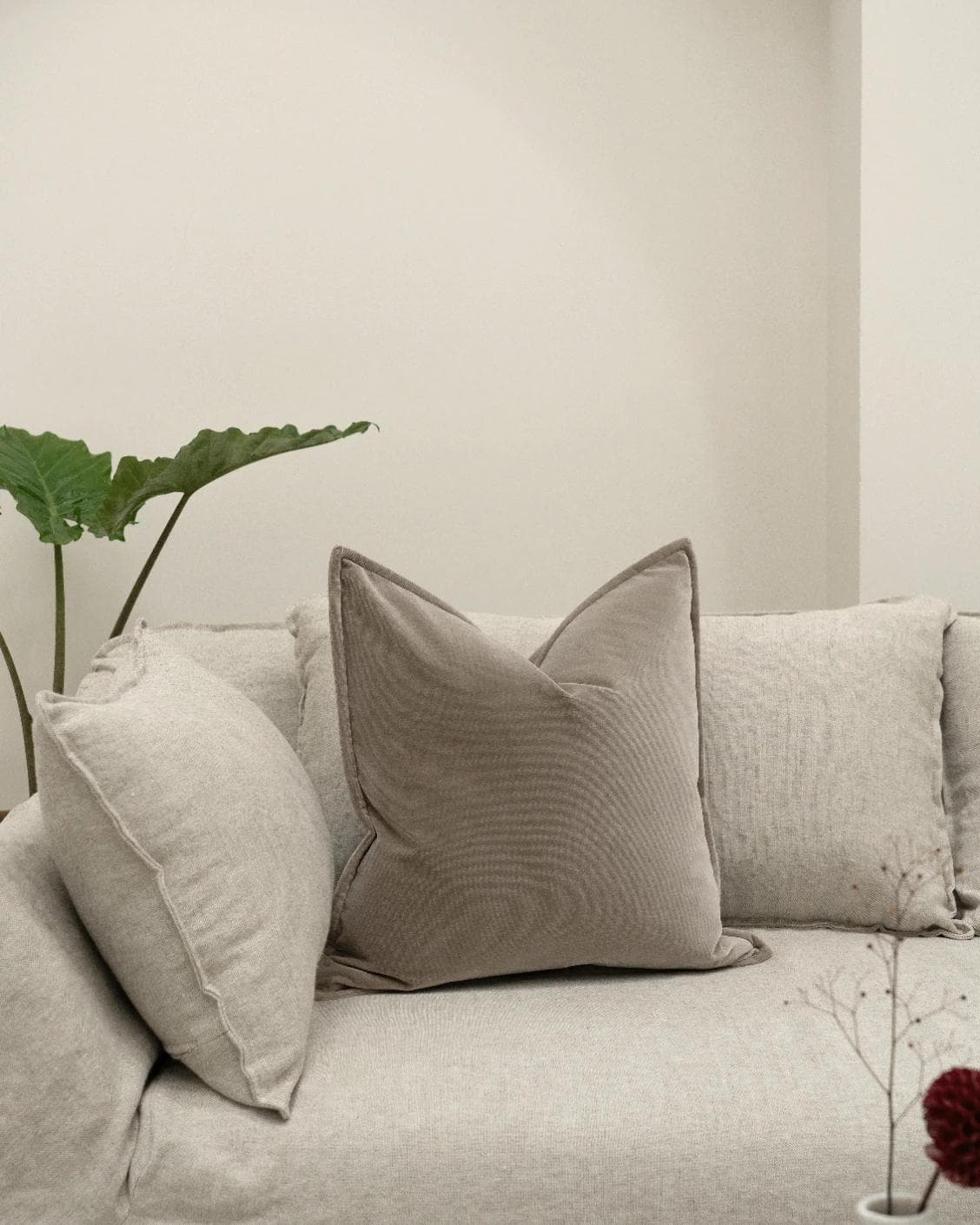 Alessandra Alpaca cushion in brown, shown in a lifestyle front view as image 2
