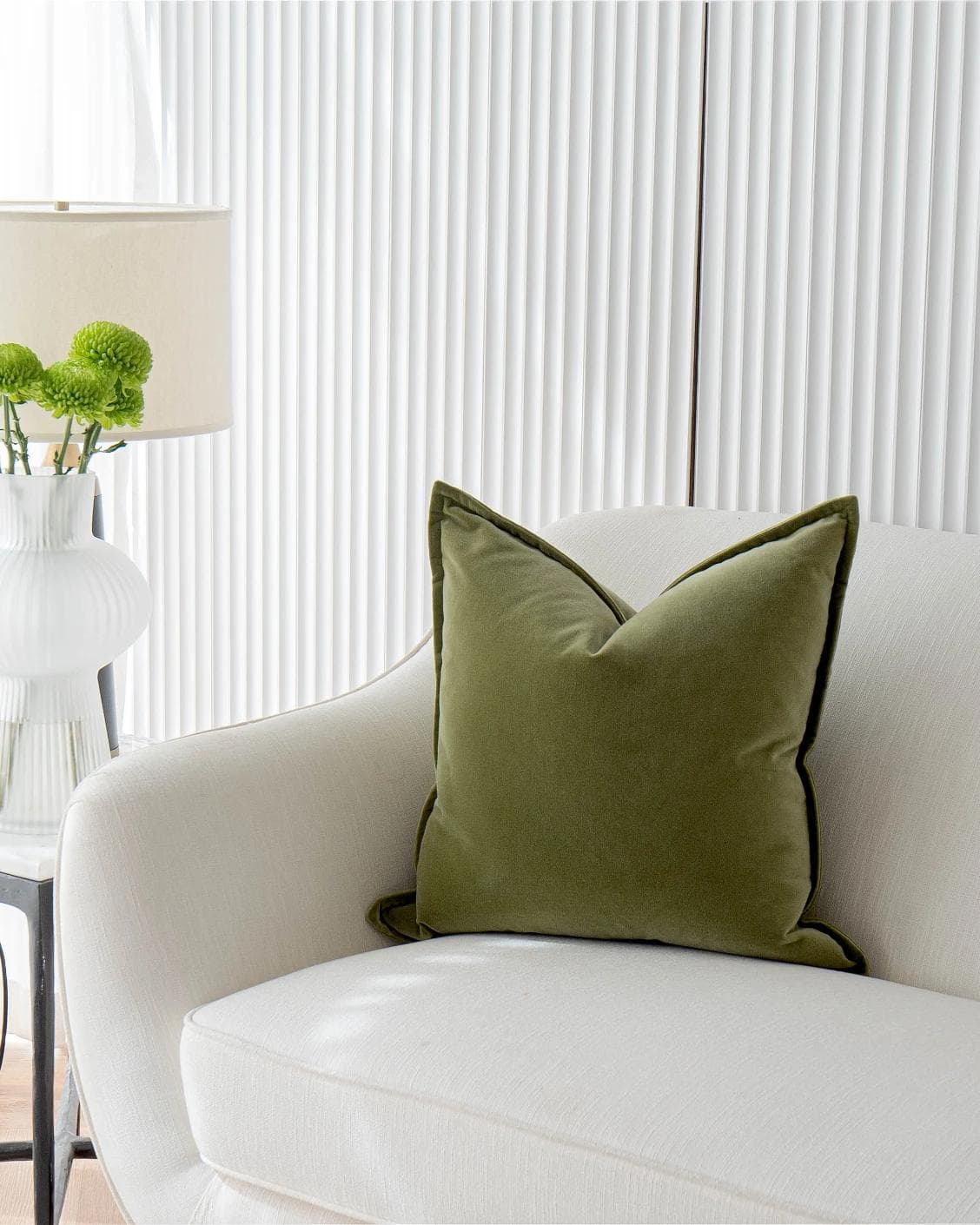 Alessandra Jade cushion in green, shown in a lifestyle front view as image 2