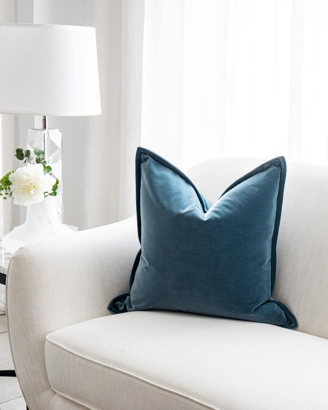 Alessandra Sky cushion in blue, shown in a lifestyle front view as image 2