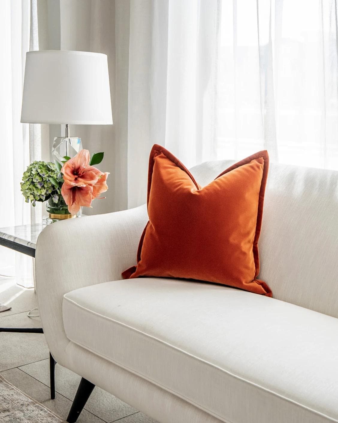 Alessandra Tangelo cushion in orange, shown in a lifestyle right view as image 2