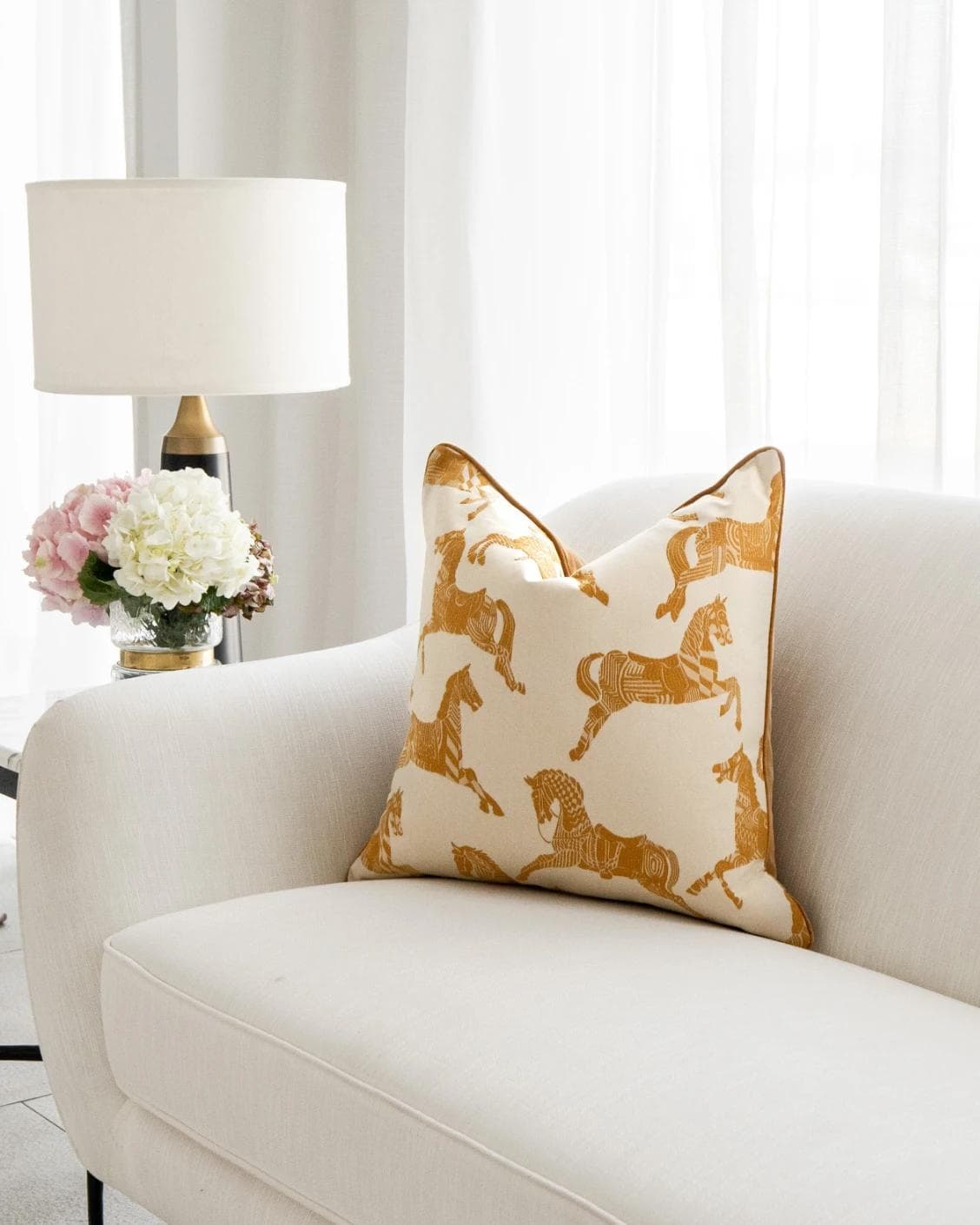 Aurora Klimt cushion in orange and beige, shown in a lifestyle right view as image 2