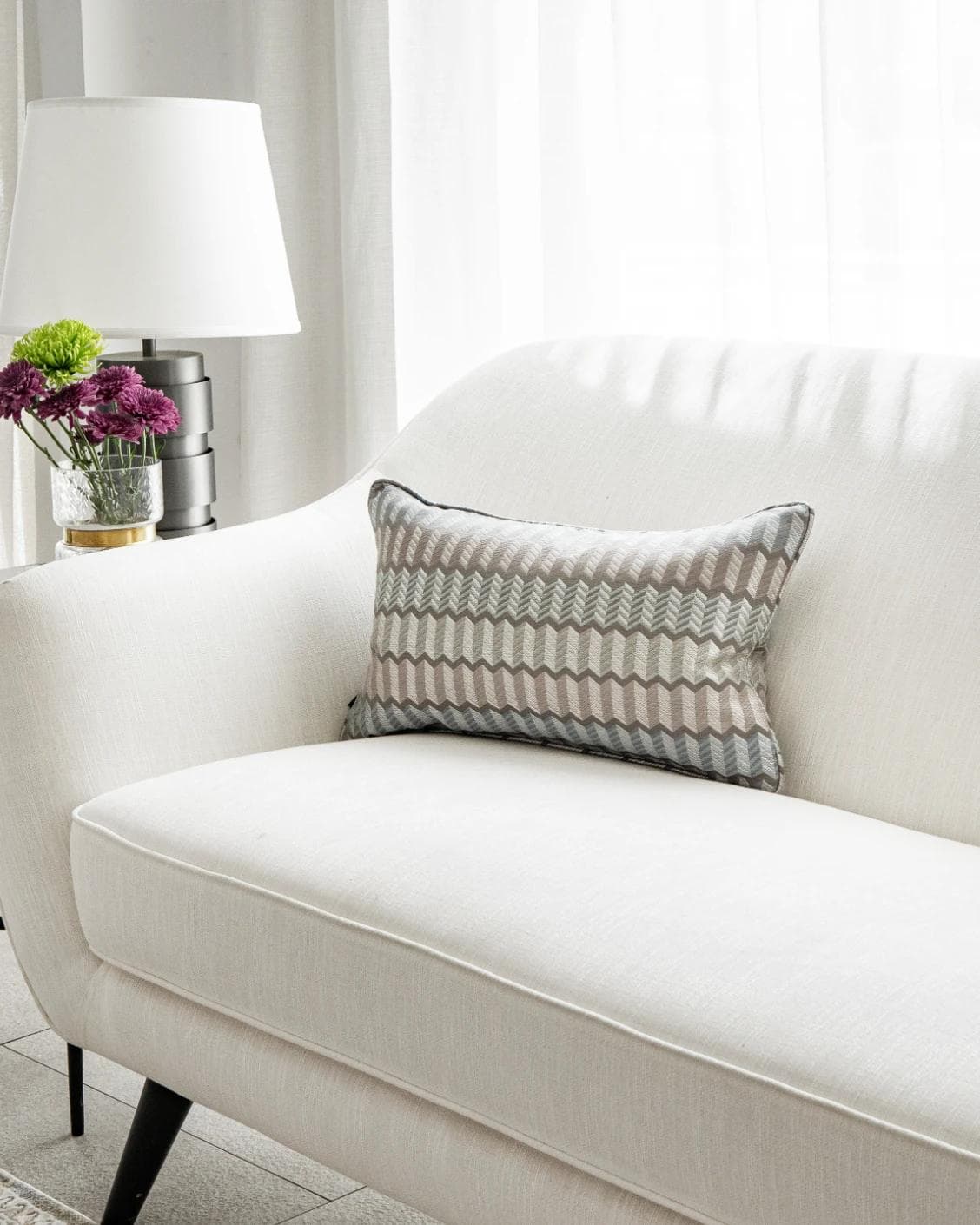 Cecilia Canova II cushion in silver, blue and multicolour, shown in a lifestyle right view as image 2