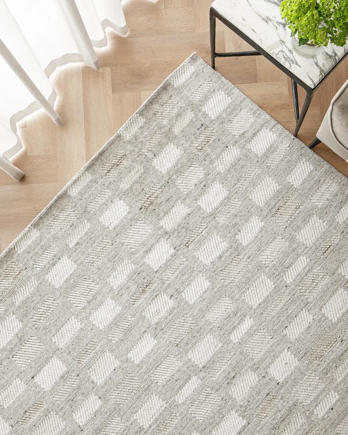 Dante Ashton carpet in grey and beige, shown in a lifestyle top view as image 2