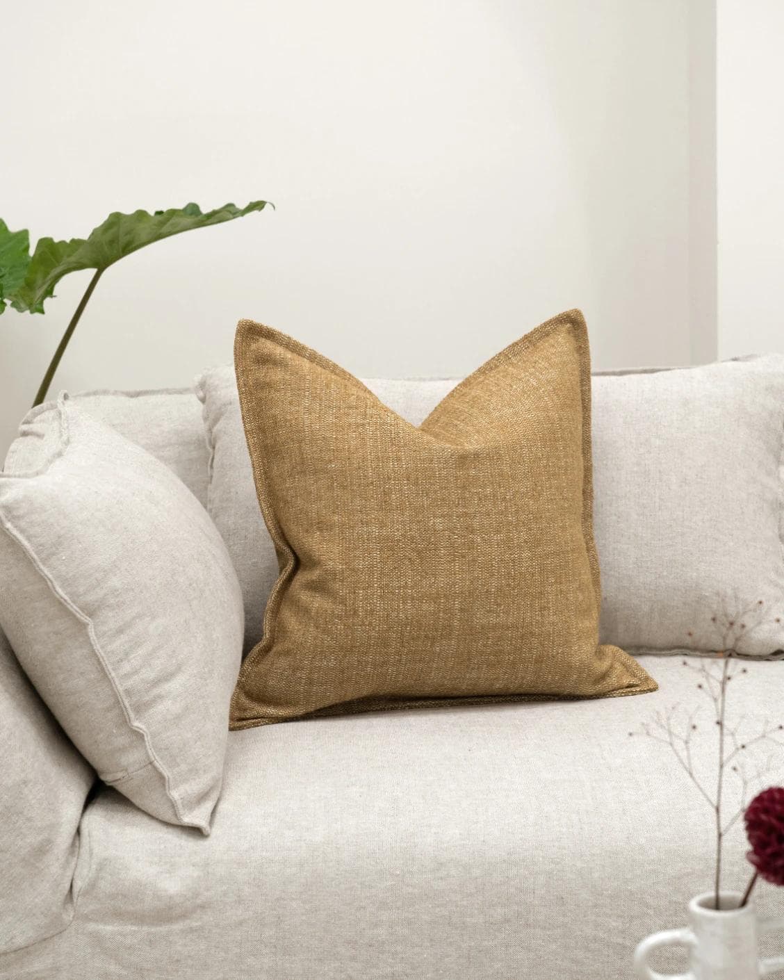 Emmett Dijon cushion in beige, shown in a lifestyle front view as image 2