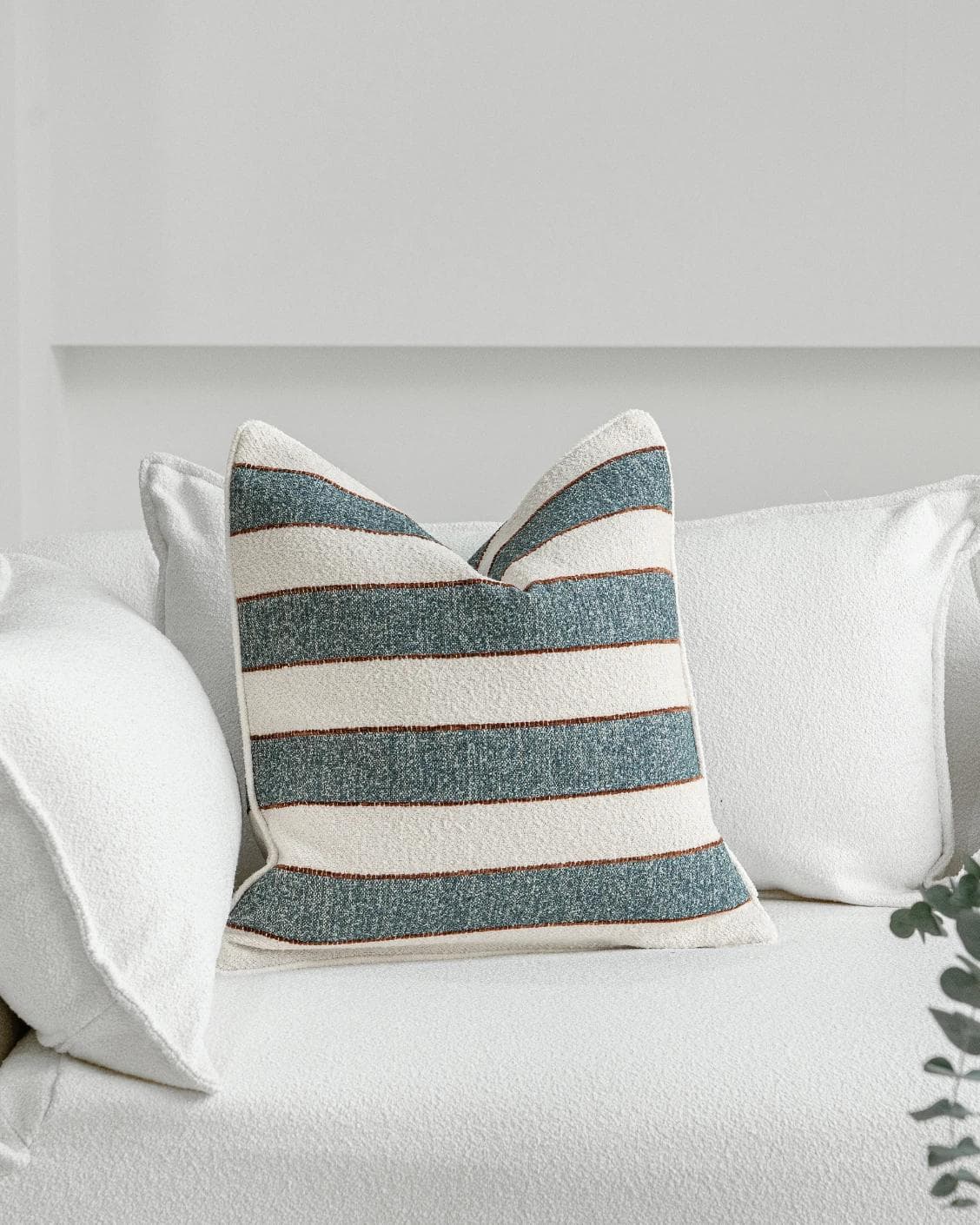 Gia Canova cushion in blue, shown in a lifestyle front view as image 2