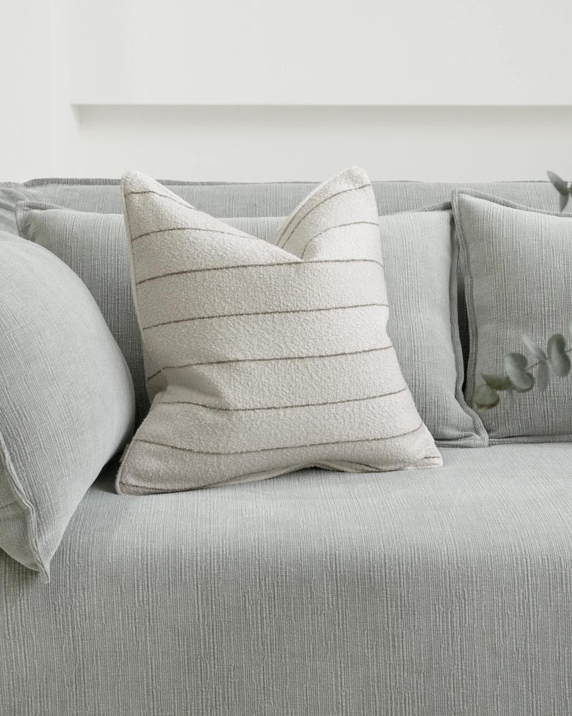 Gia Laurent cushion in ivory, shown in a lifestyle front view as image 2