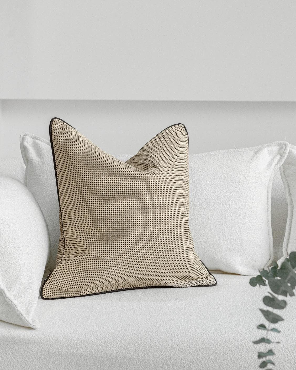 Ginny Laurent cushion in cream, shown in a lifestyle front view as image 2