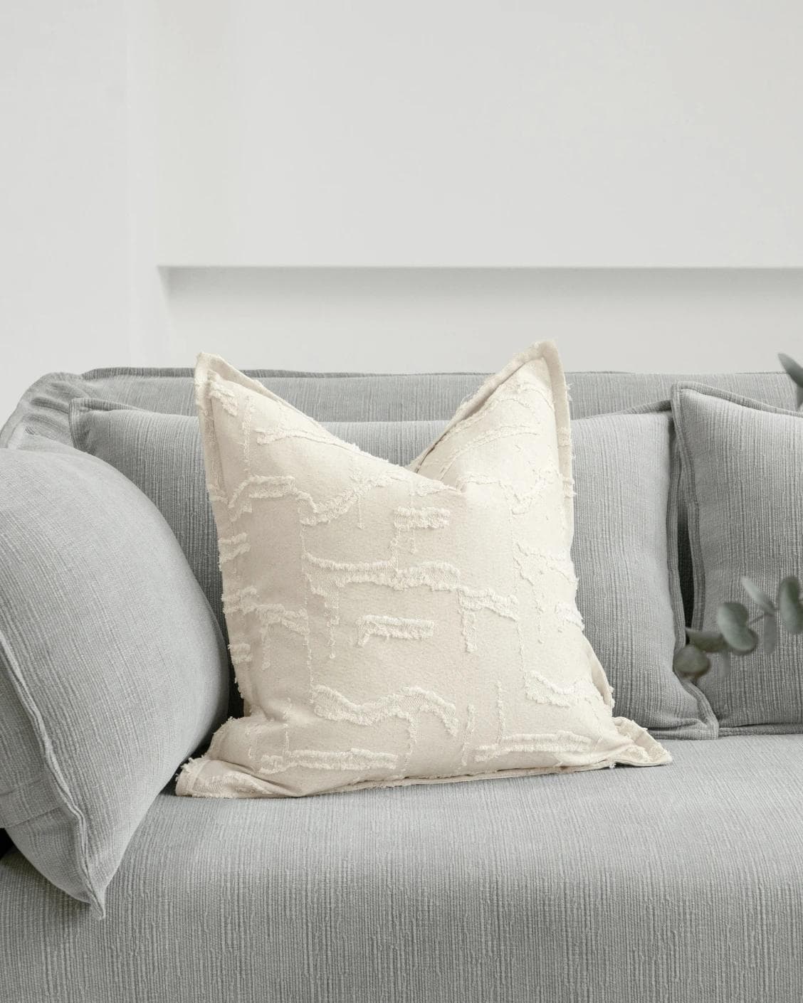 Heeth Laurent cushion in cream and ivory, shown in a lifestyle front view as image 2