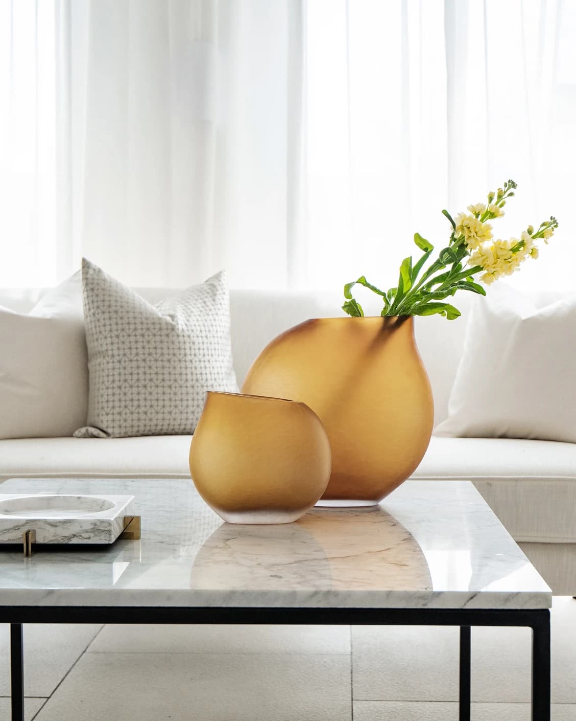 Denise Bundle vases in orange, shown in a lifestyle front view as image 1