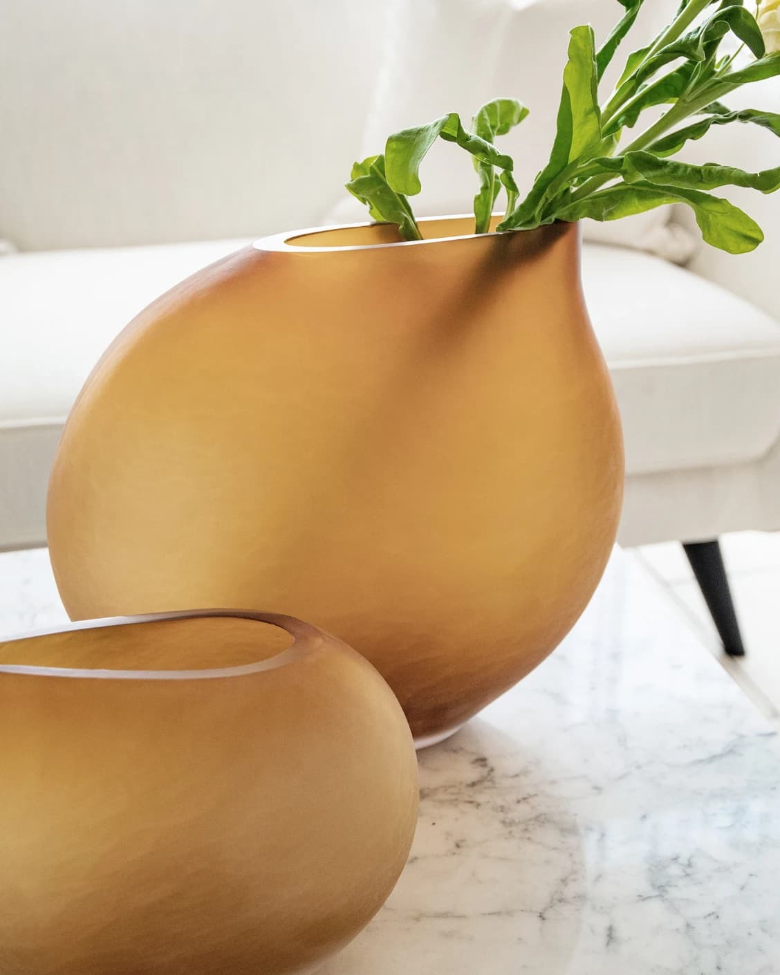 Denise Bundle vases in orange, shown in a lifestyle left view as image 3