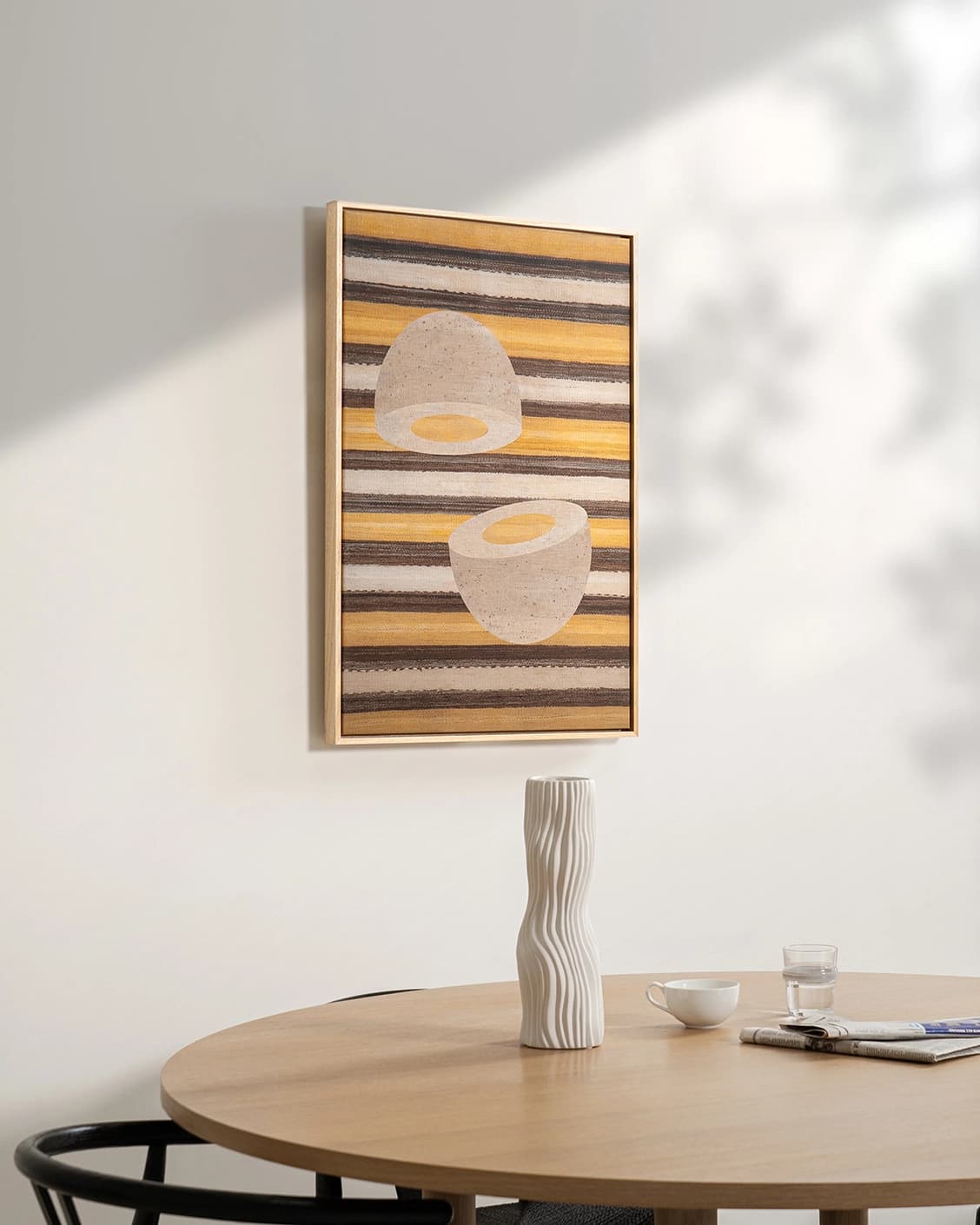 Eggercise canvas in yellow, brown and beige, shown in a lifestyle left view as image 2