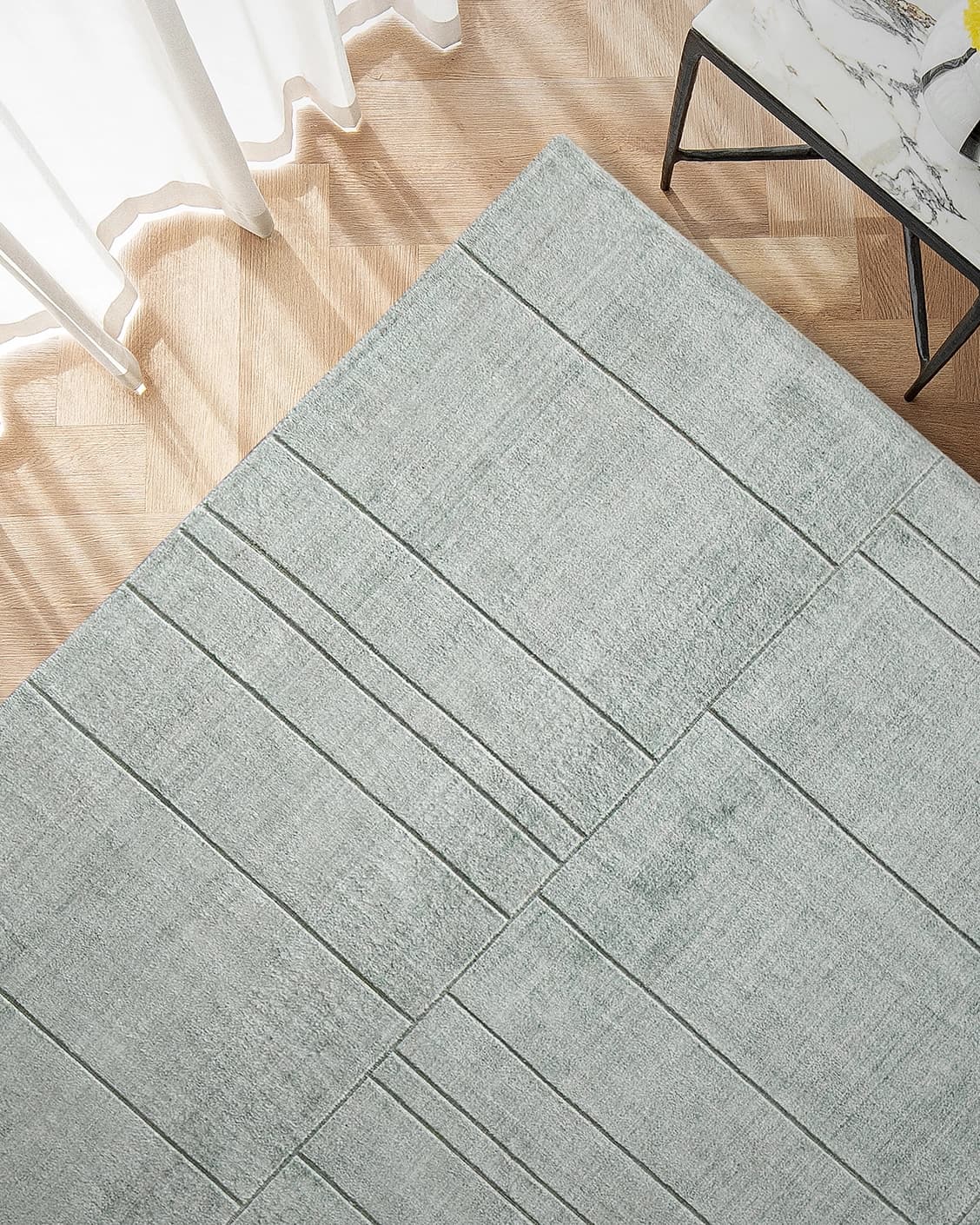 Elliot Azure carpet in azure and green, shown in a lifestyle top view as image 2