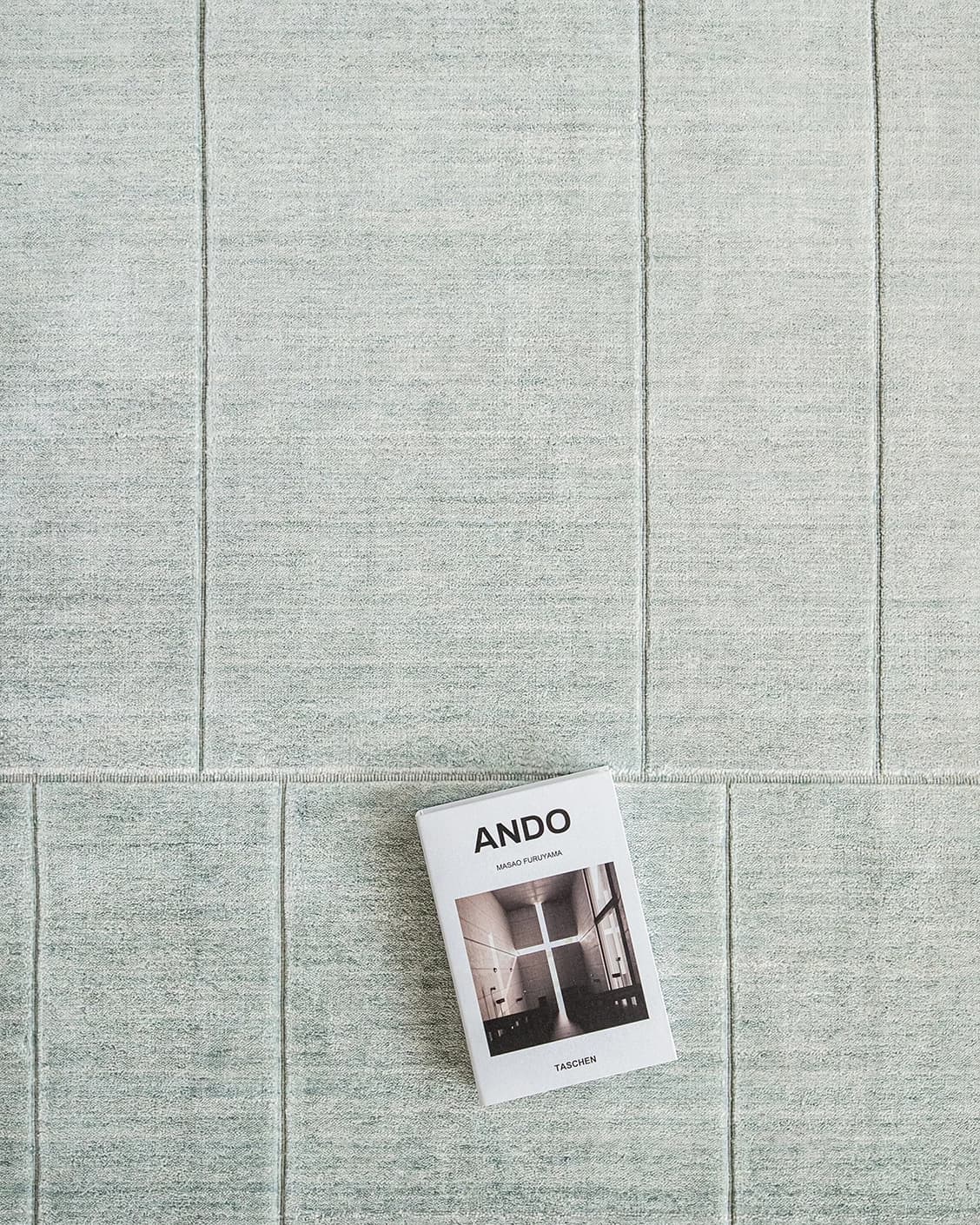 Elliot Azure carpet in azure and green, shown in a lifestyle top view as video image