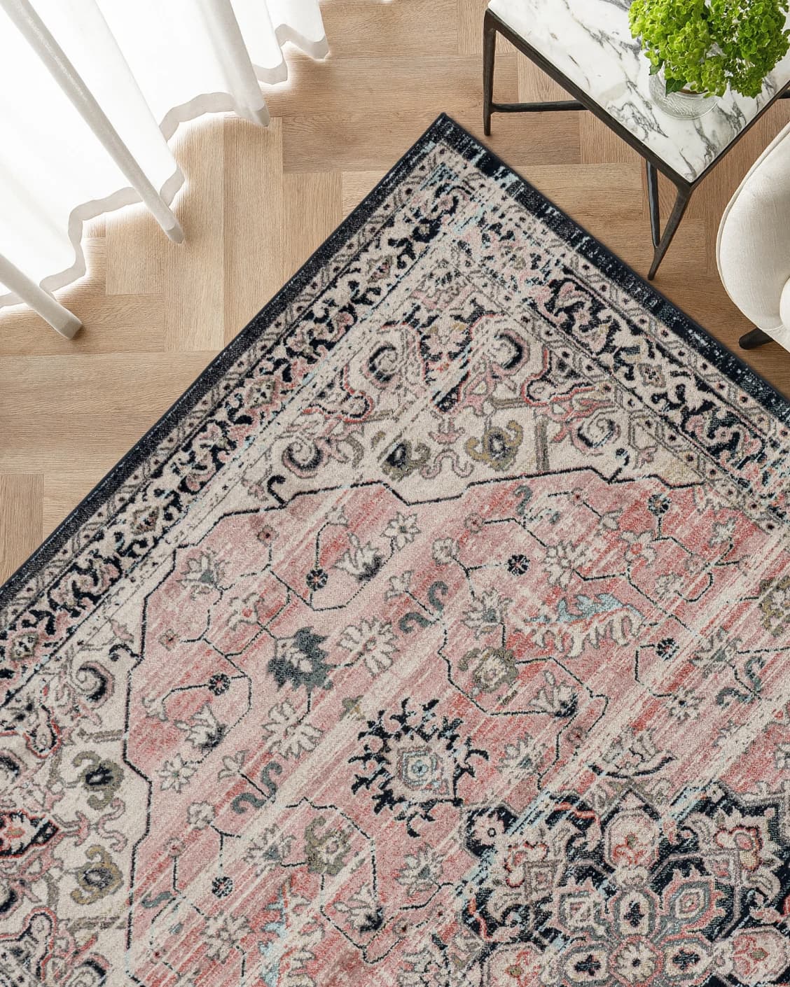 Julian Terracotta carpet in grey and pink, shown in a lifestyle top view as image 2