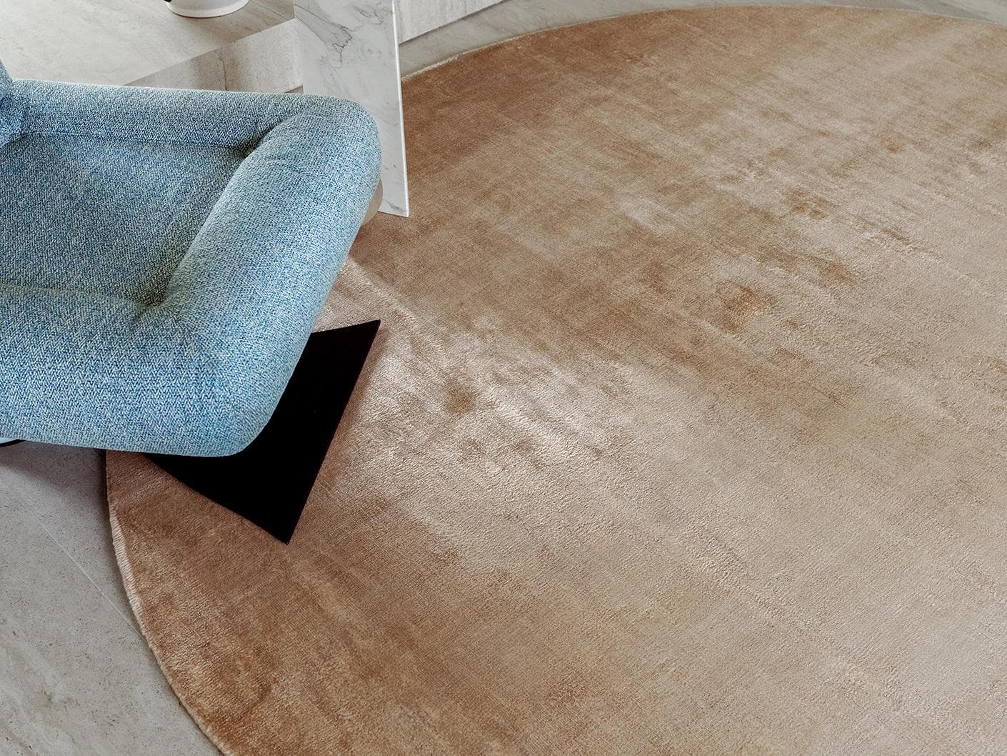 Oscar Sandy carpets in beige, shown in a lifestyle close-up top view as image 1