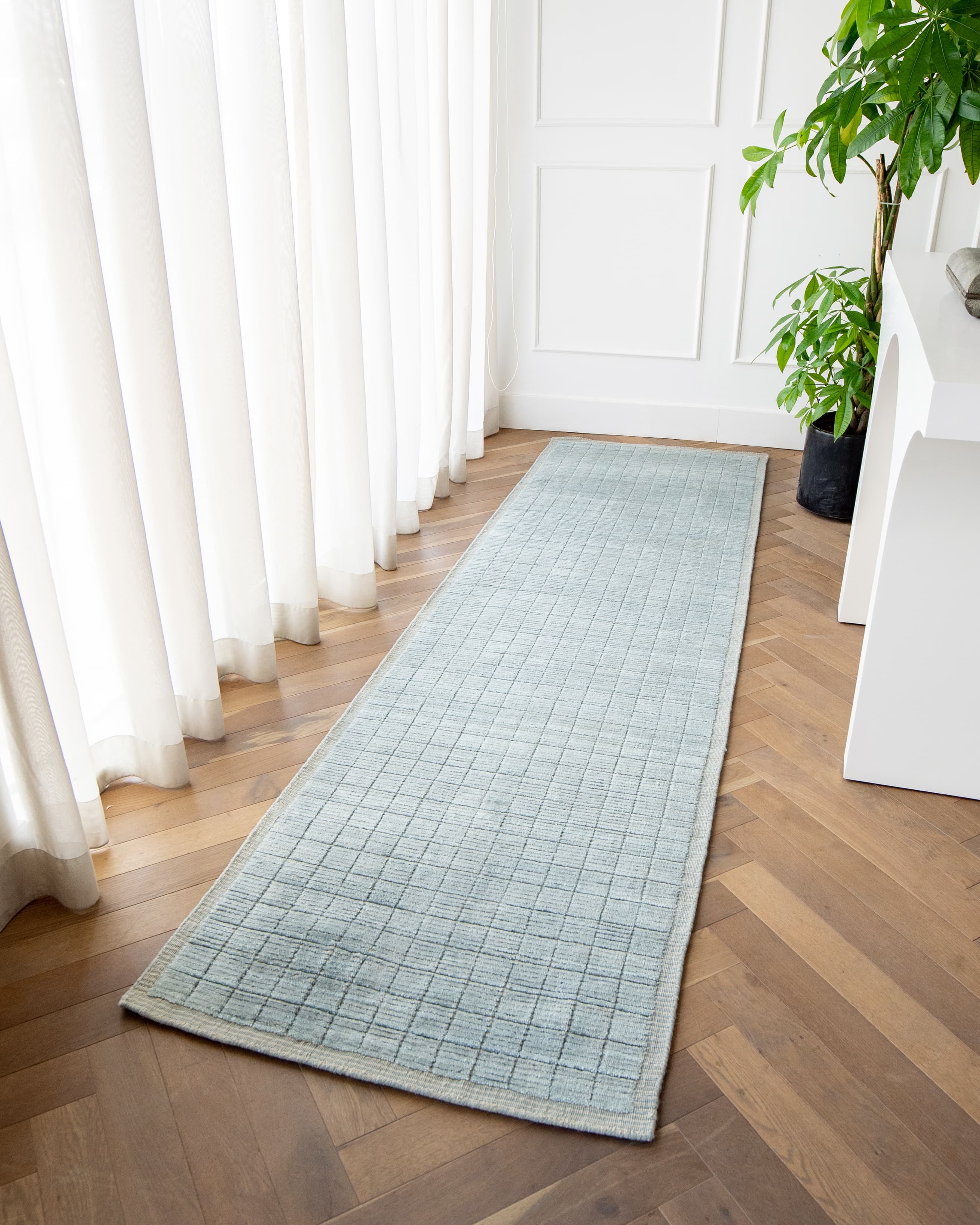 Taylor Sky Runners carpet in sky, shown in a lifestyle front view as image 2