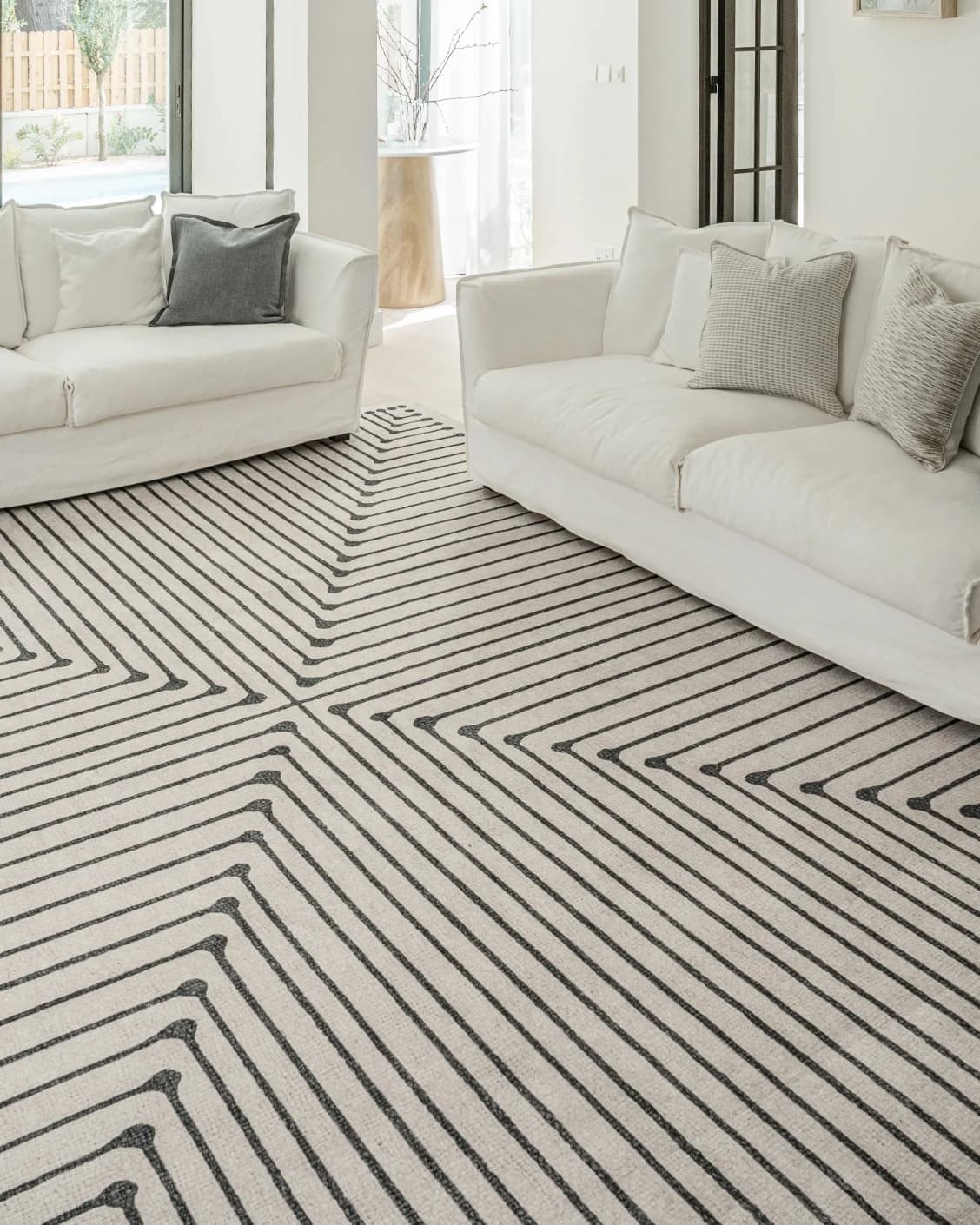 Vince Bianca carpet in black and white, shown in a lifestyle front view as image 4