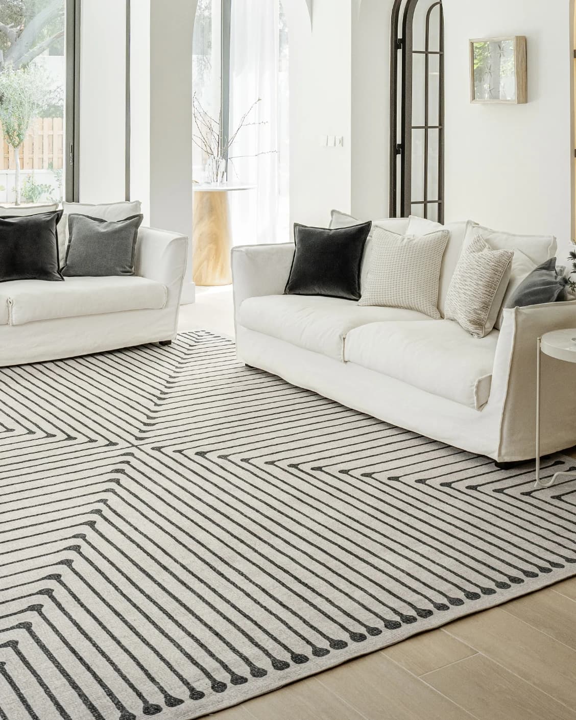 Vince Bianca carpet in black and white, shown in a lifestyle front view as image 5