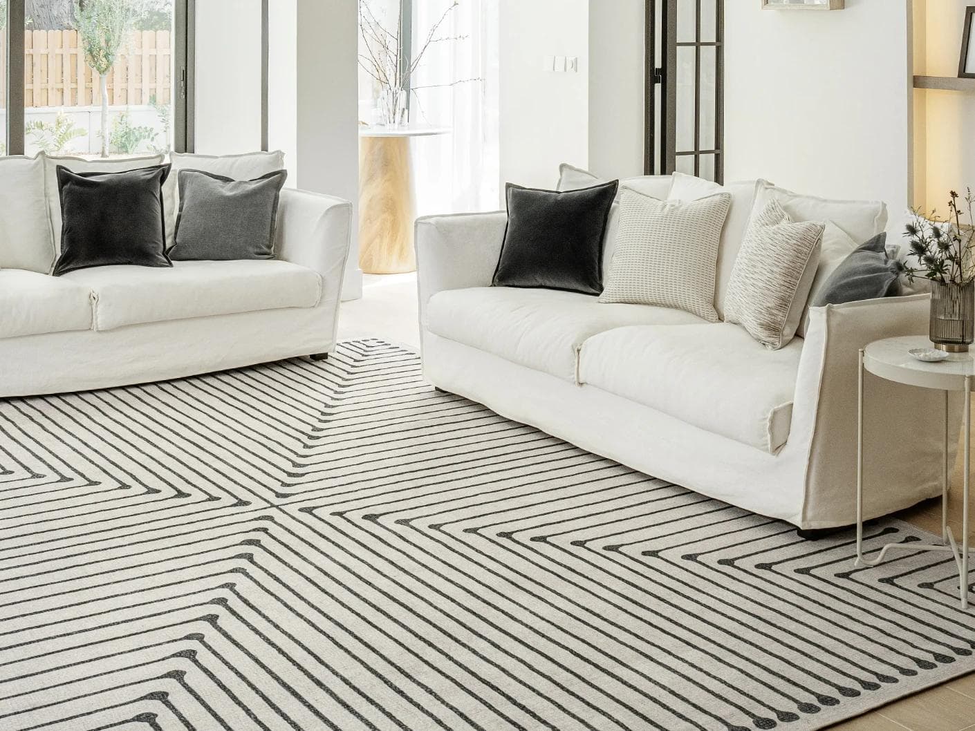 Vince Bianca carpet in black and white, shown in a lifestyle front view as image 5