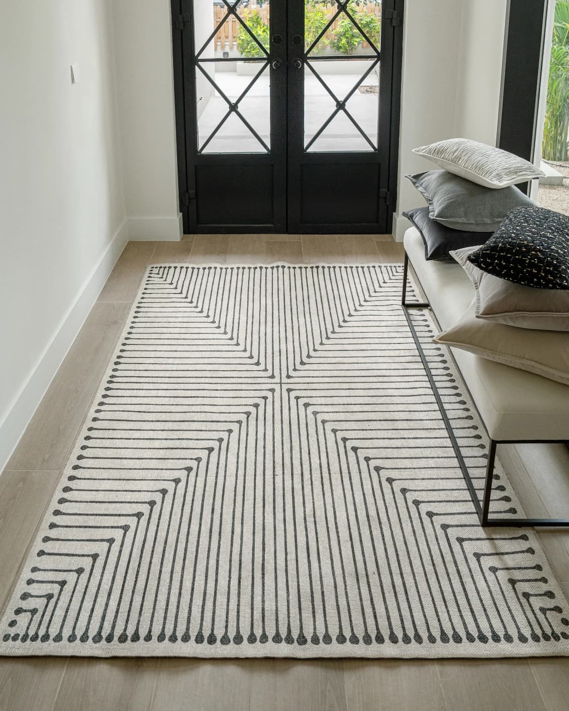 Vince Bianca carpet in black and white, shown in a lifestyle front view as image 6