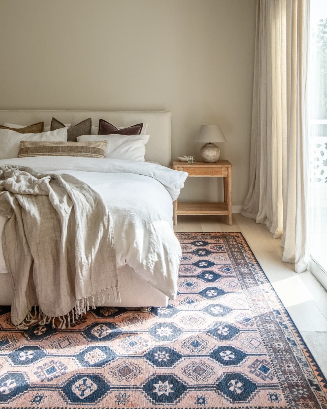 Vincent Blossom carpet in pink, blue and multicolour, shown in a lifestyle front view as image 18