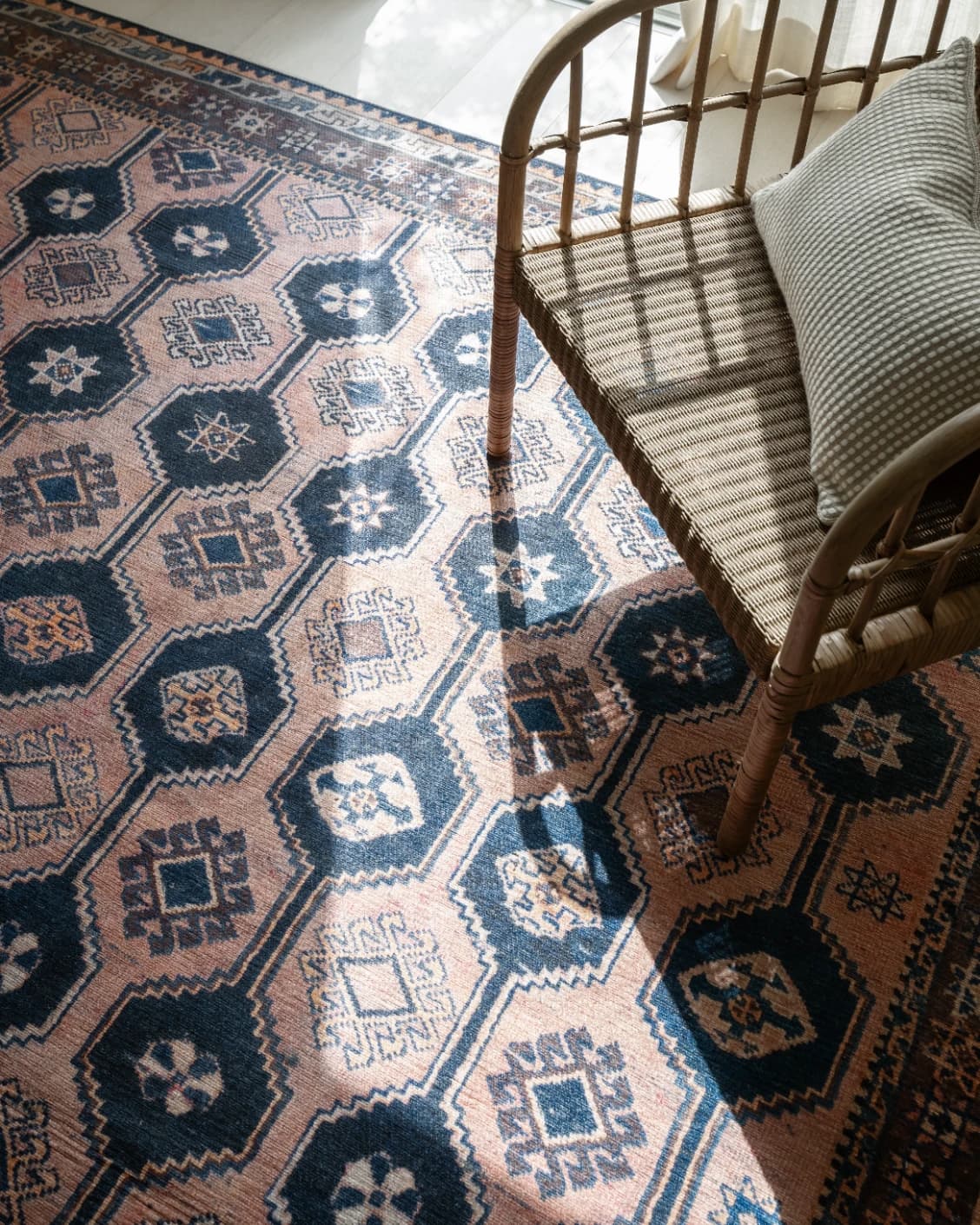 Vincent Blossom carpet in pink, blue and multicolour, shown in a lifestyle top view as image 25