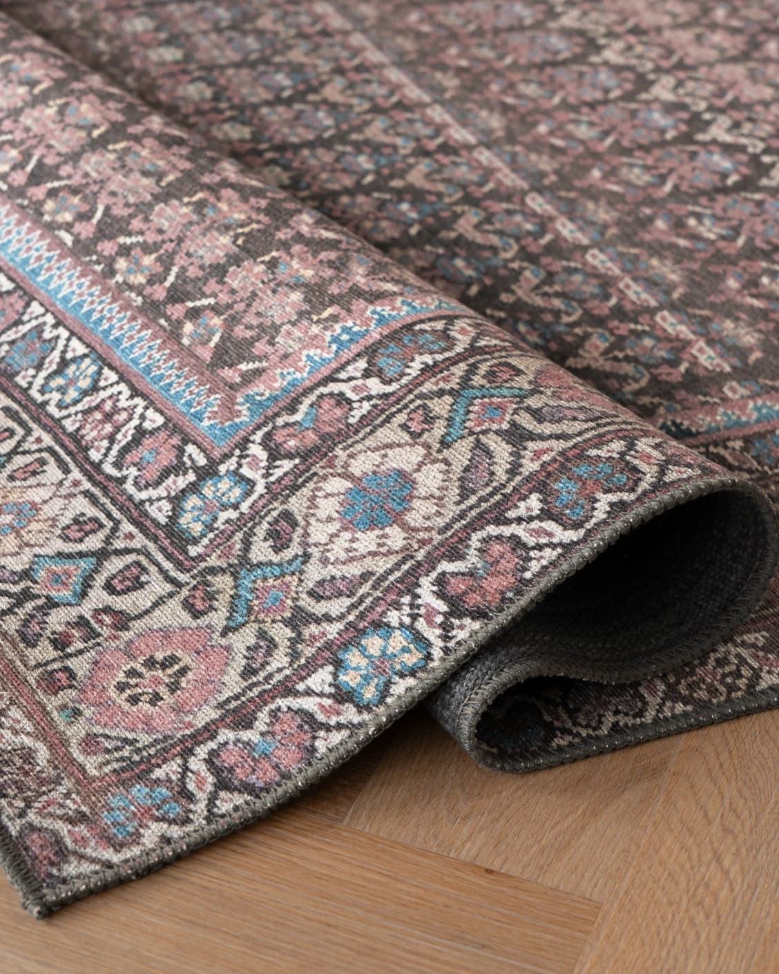 Vincent Umber carpet in red, blue and multicolour, shown in a product close-up as image 24