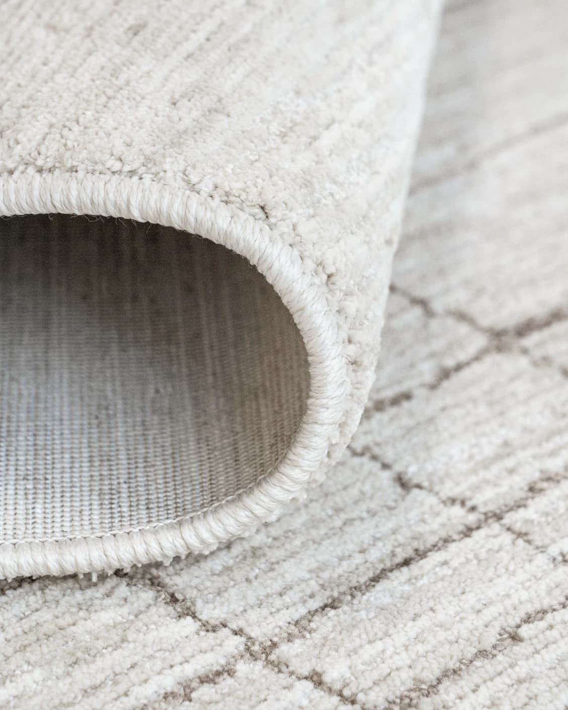 Zion Sandy carpets in ivory, shown in a product close-up as image 2