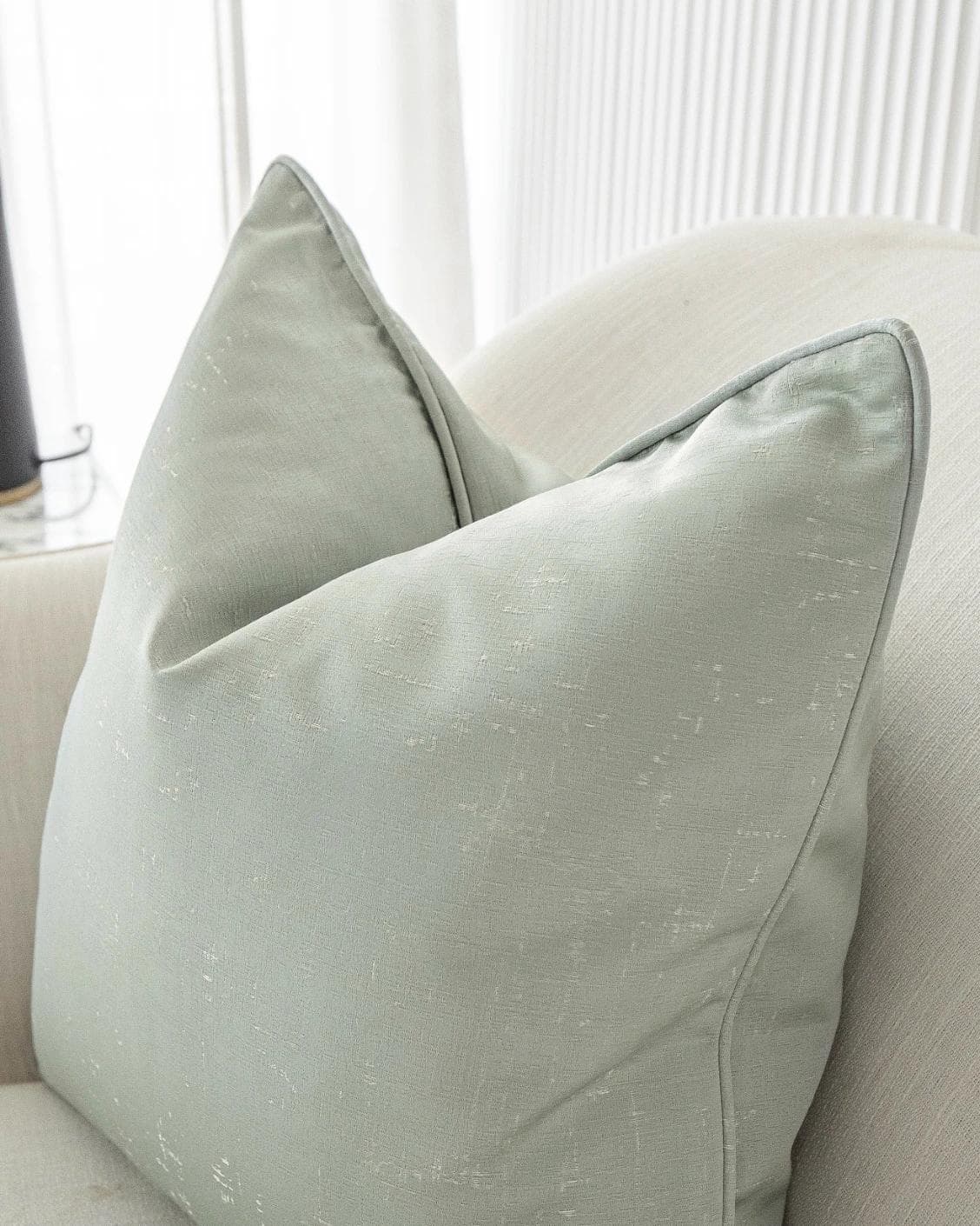 Lainie Sofia cushion in green and silver, shown in a product right view as image 5