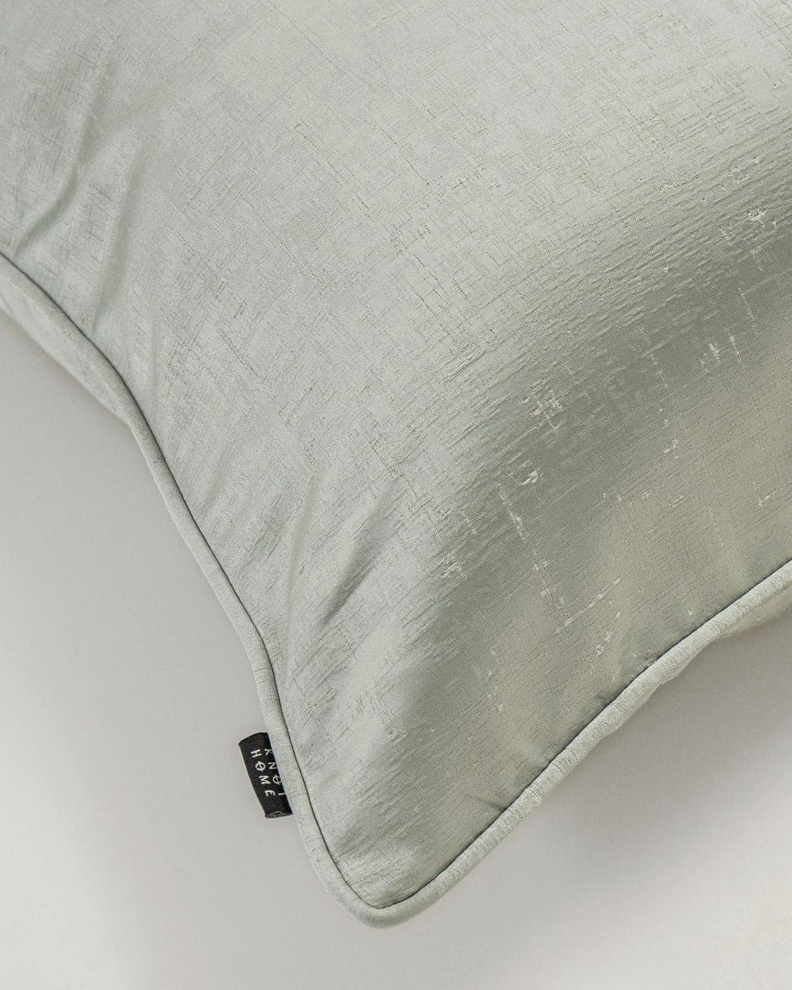 Lainie Sofia cushion in green and silver, shown in a product top view as image 6