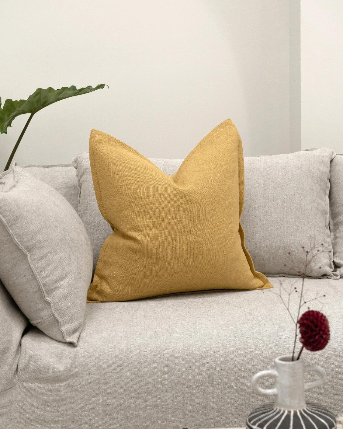 Mel Barrymore cushion in yellow, shown in a lifestyle front view as image 2