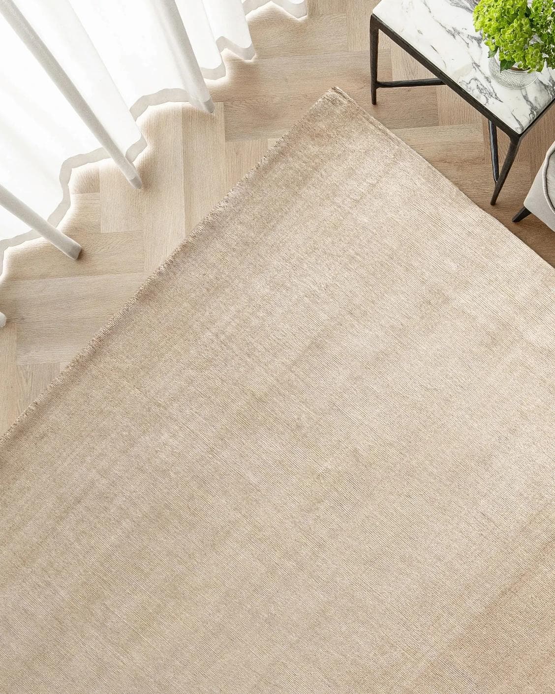 Oscar Sandy carpet in beige, shown in a lifestyle top view as image 2