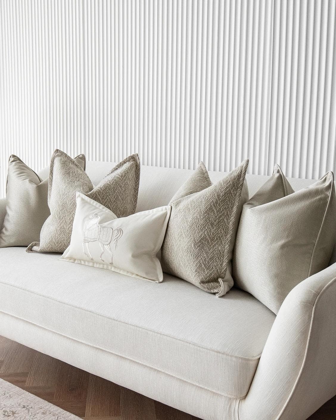Sugar Bundle cushion in gold, beige and white, shown in a lifestyle right view as image 2
