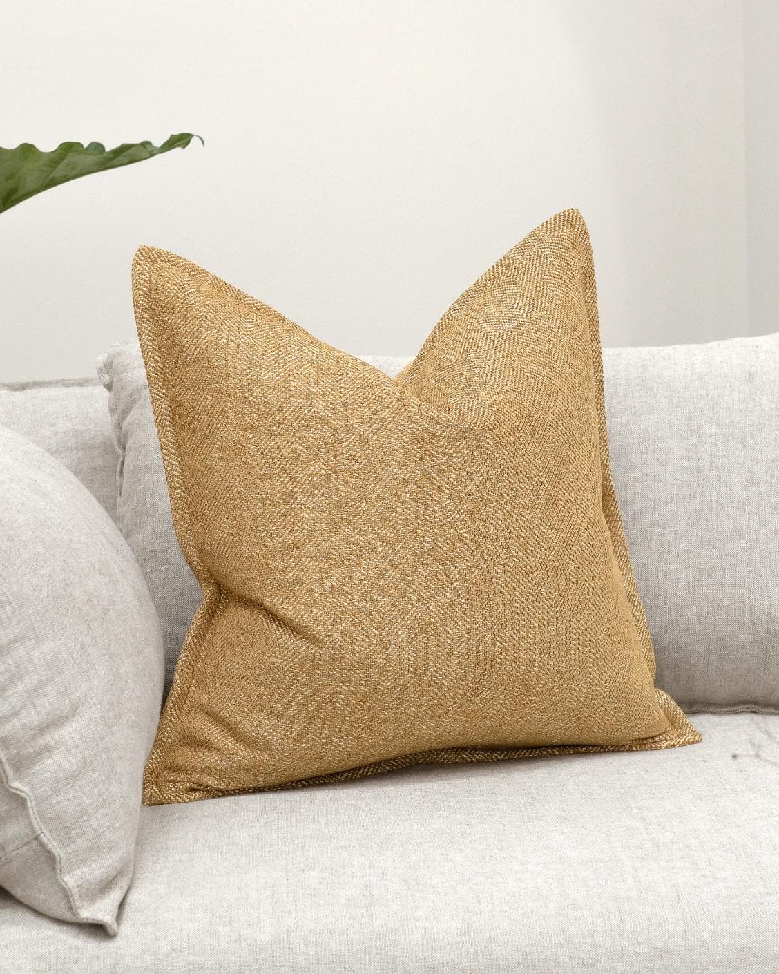 Rue Gaze cushion in beige, shown in a lifestyle as image 2