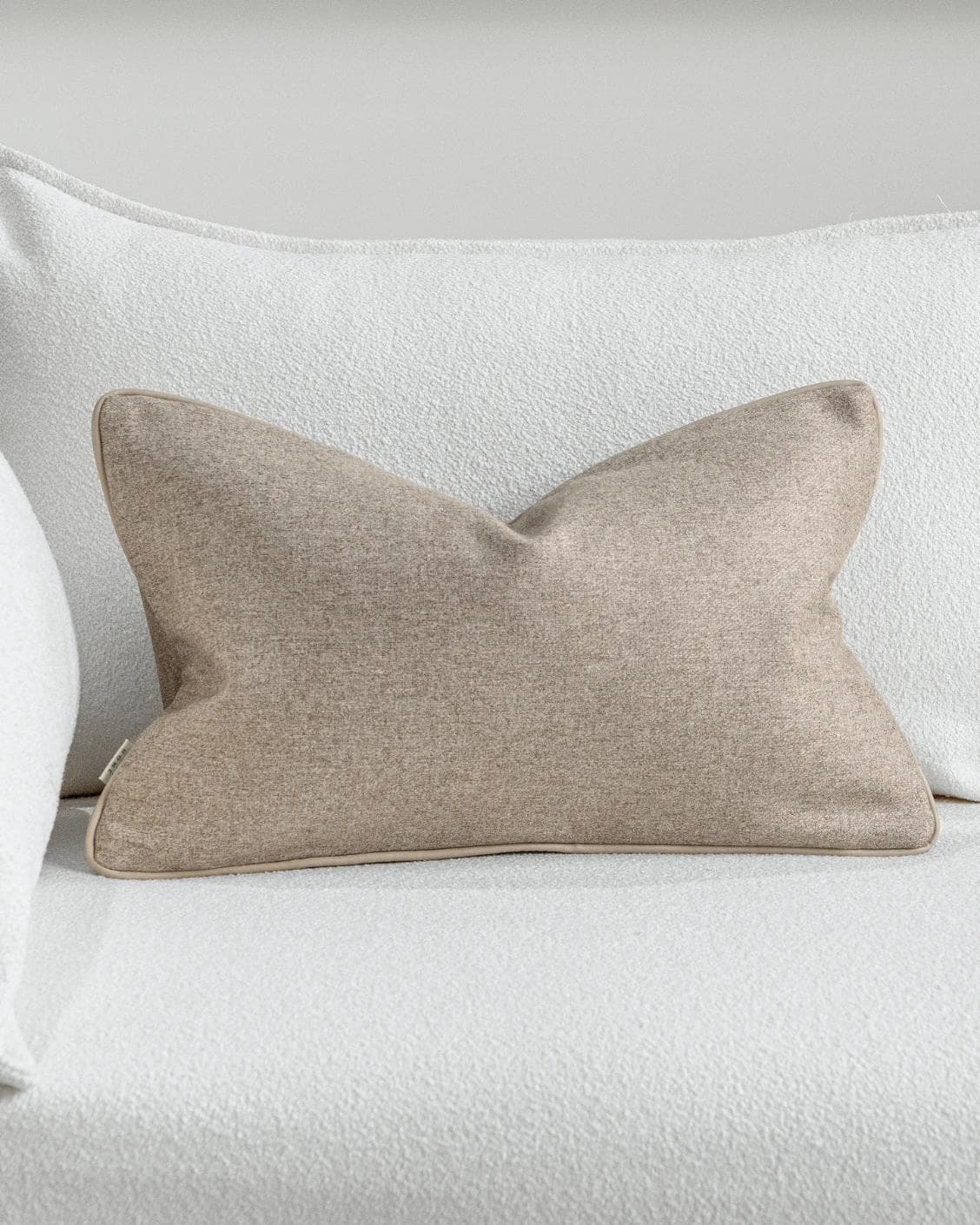 Silvie Laurent II cushion in taupe, shown in a lifestyle front view as image 2