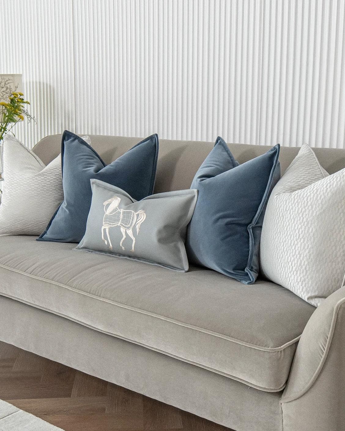 Kristal Bundle cushion in blue, silver and white, shown in a lifestyle right view as image 2