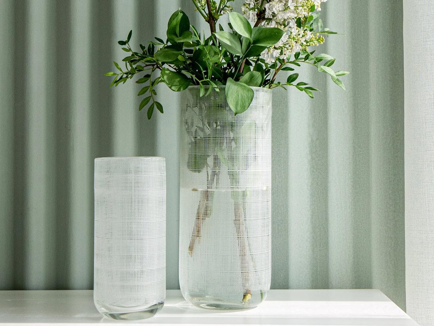 Zaha Bundle vases in white and translucent, shown in a lifestyle front view as image 5